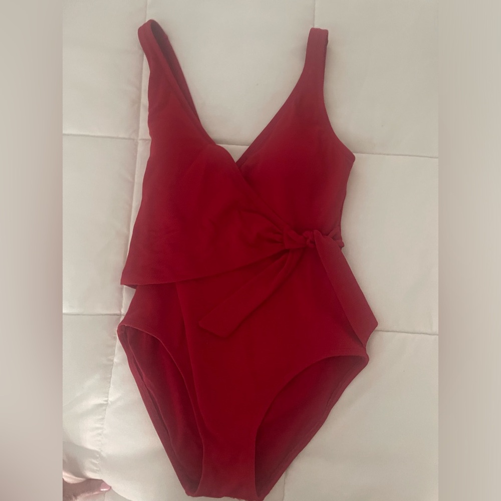 Pretty in red! Flattering suit with dive front.
